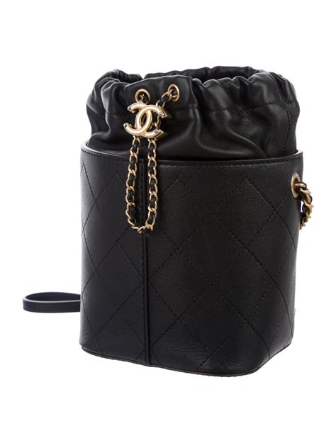 black leathe chanel bag with drawsring closure|Chanel bucket bag 2021.